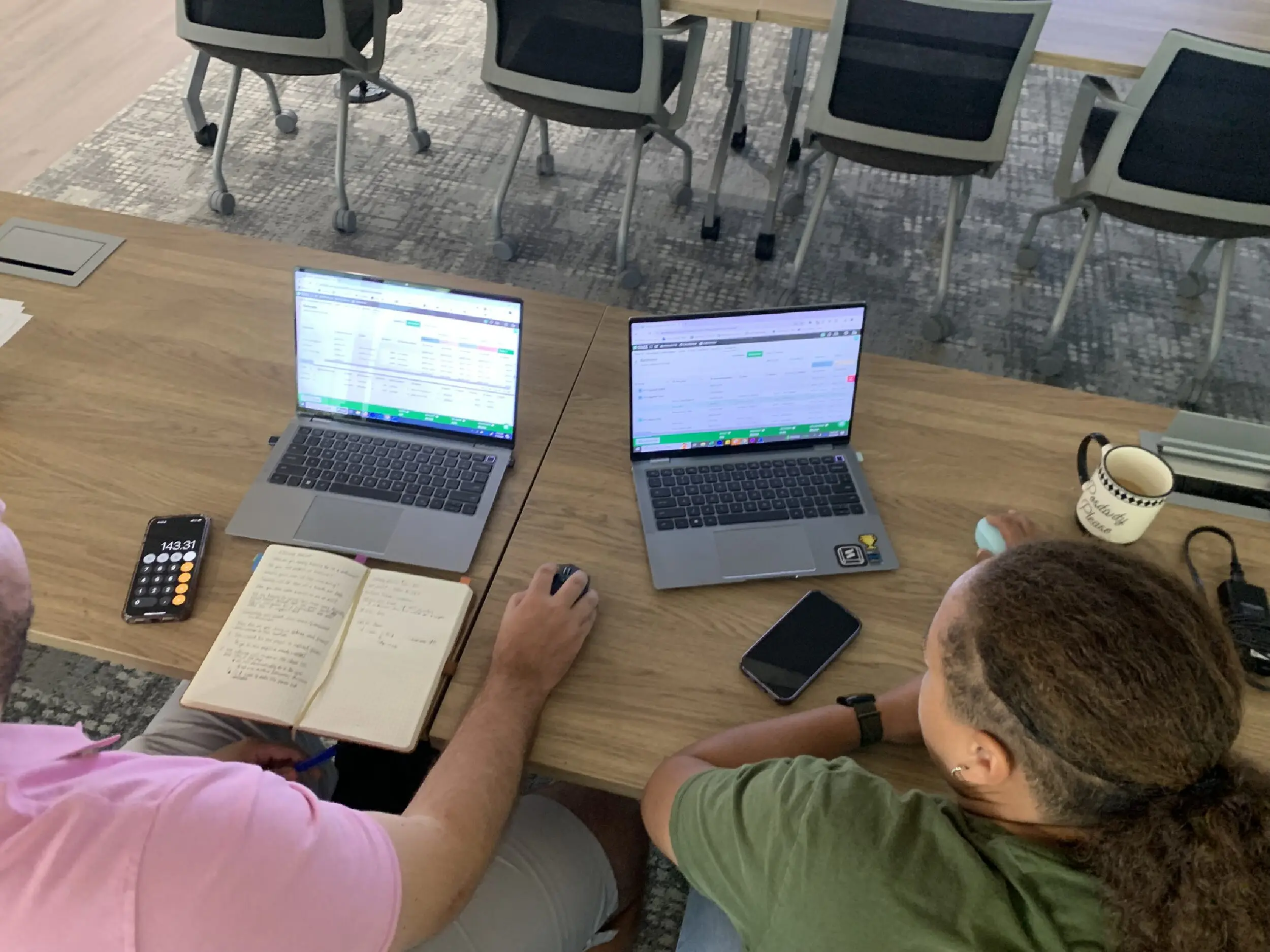 STACK Staff work on laptops to participate in the estimating workshop.